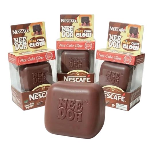 SquishStudio Nescafé Nee Doh Nice Cube Glow sensory stress relief toy in brown, shown with retail packaging.